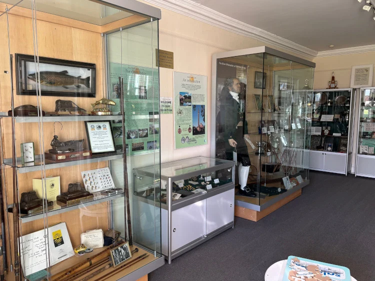 Cabinets including angler in traditional dress